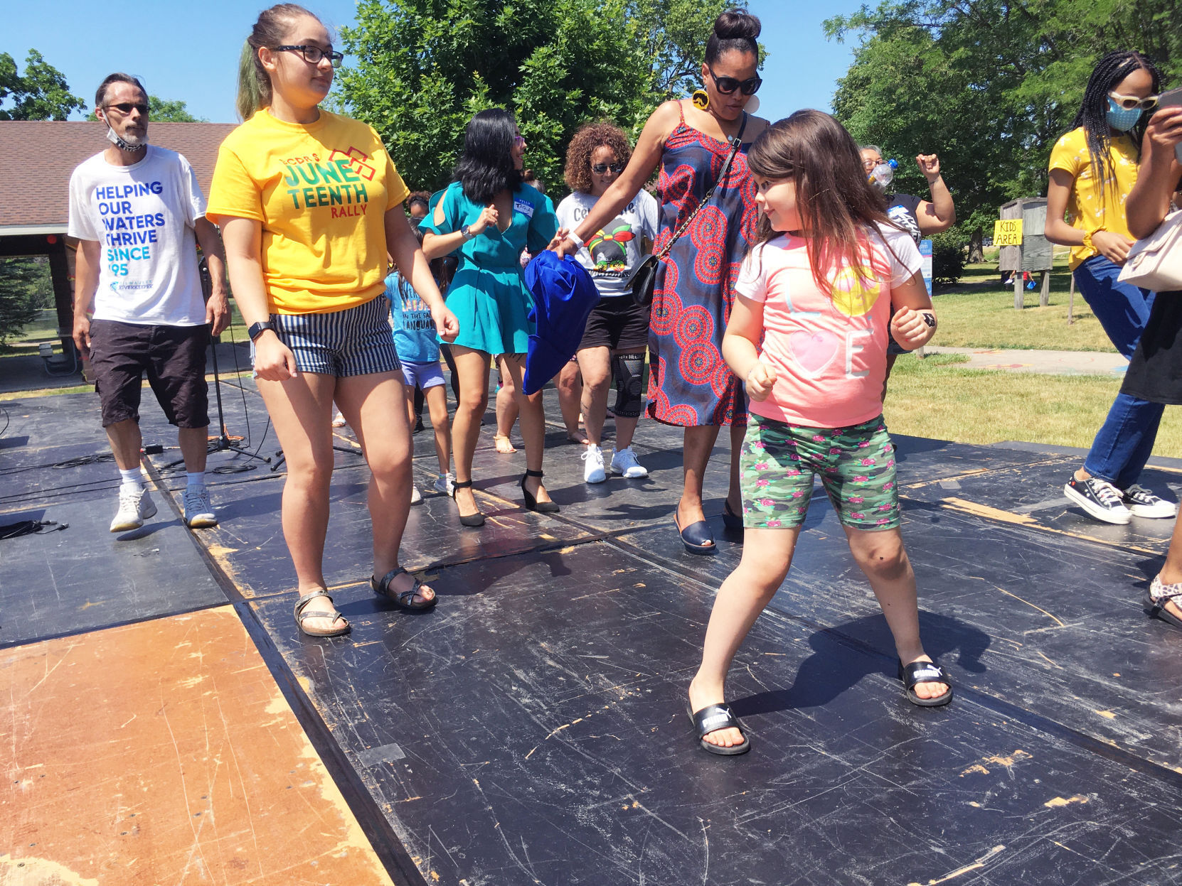Harley Bagley, 5, joins other dancers on stage at Burlington Juneteenth event